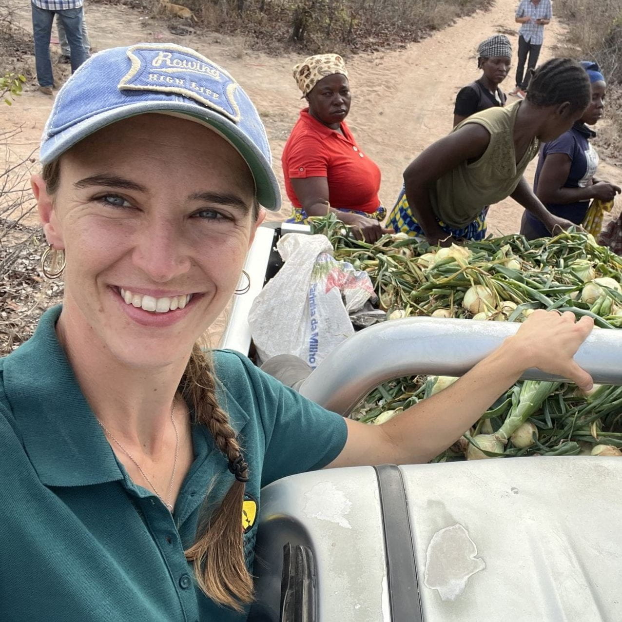 Cara Myers and others with crops in pickup truck