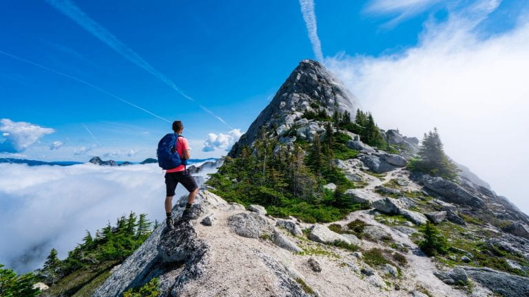 Person summiting a mountain