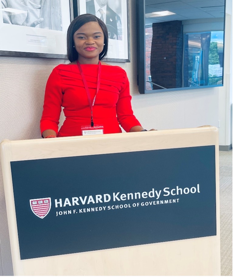 Esther standing at HKS podium