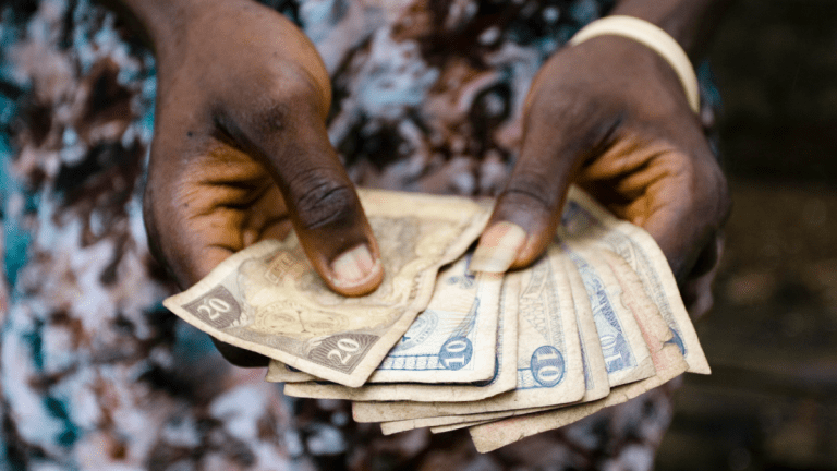 Hands holding cash