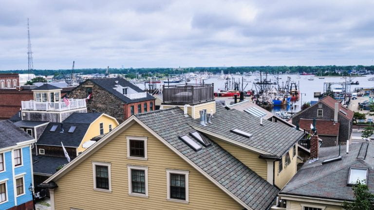 Stores and homes overlooking the water in a historic town