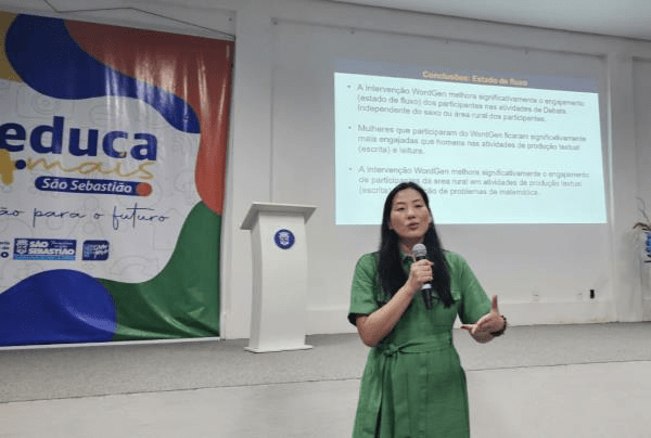 a woman speaking and presenting