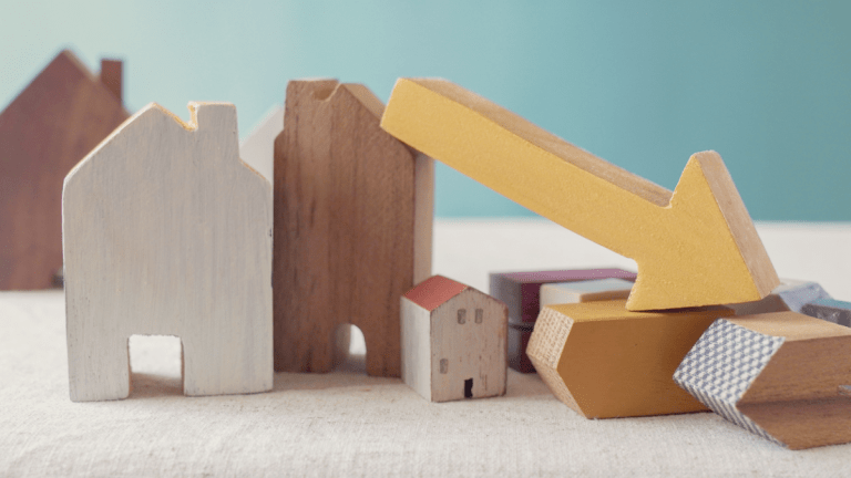 Houses with a downward pointing arrow