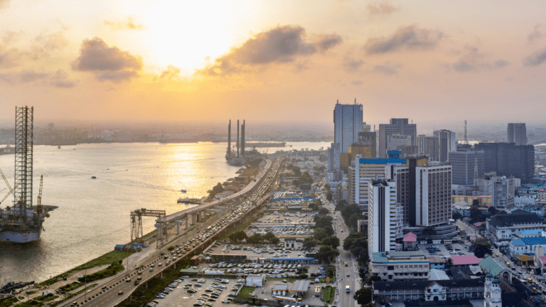A panorama shot of a Landscape showing the coastline of Lagos Island, Nigeria at sunset, the Atlantic and a rig