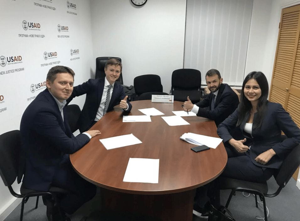 a group sitting around a meeting table