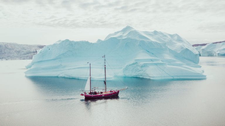 A ship sailing near an iceberg