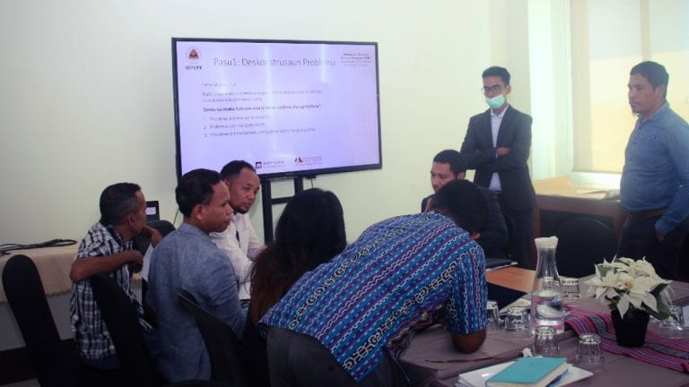 Practitioners collaborating during a workshop in Timor-Leste