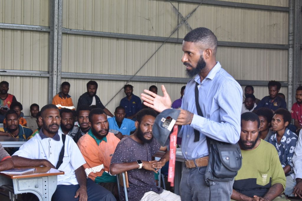 A person presenting to an audience