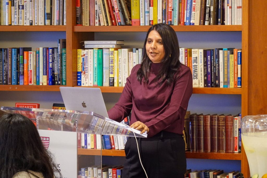 Yamini Aiyar presenting at podium