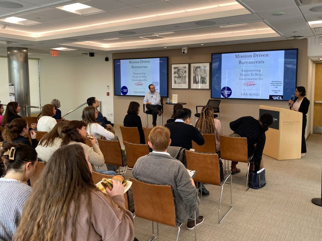 Salimah Samji introducing Dan Honig to audience members