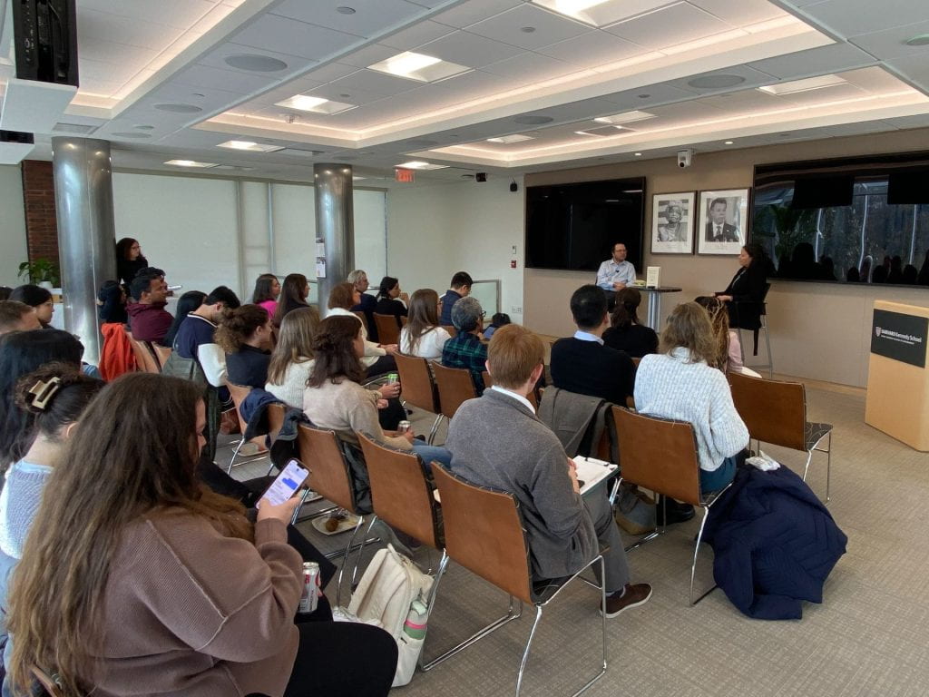 Dan Honig and Elizabeth Linos presenting to a room of students