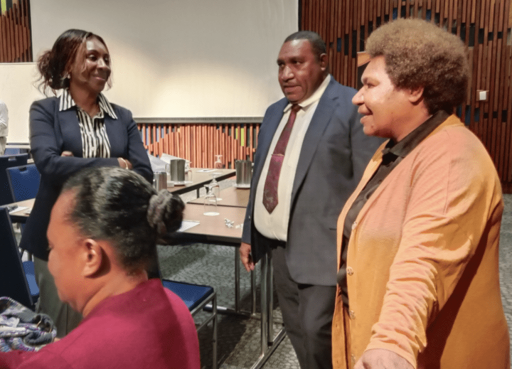 PNG Themis primary authorizer Secretary Jerry Ubase from the DfCDR in conversation