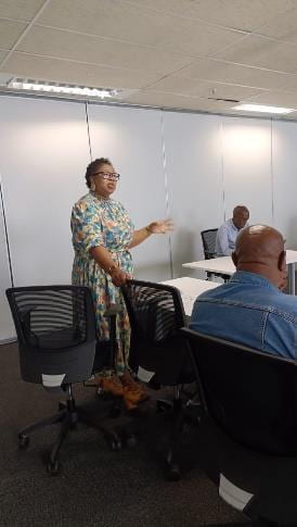 Pinky presenting in a classroom