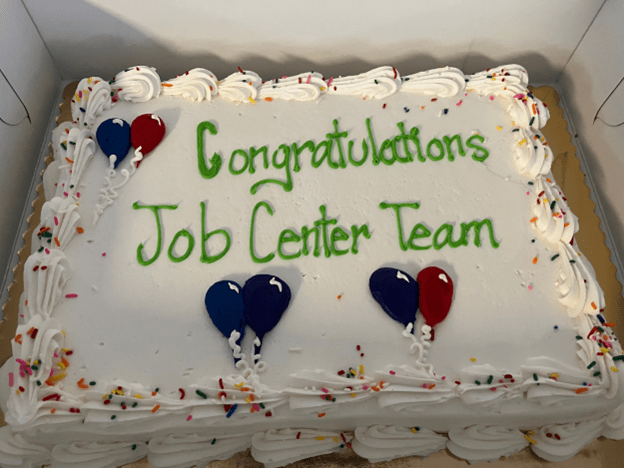Cake that says "Congratulations Job Center Team"