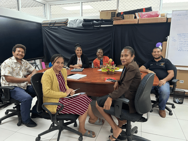 Team members at a roundtable