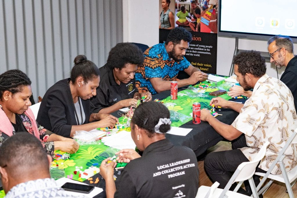 A team collaborating on a group exercise