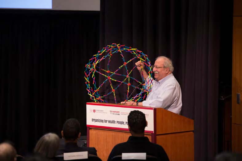 Marshall Ganz presenting holding a Hoberman sphere