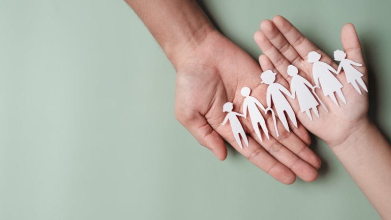 Paper cut-out of family