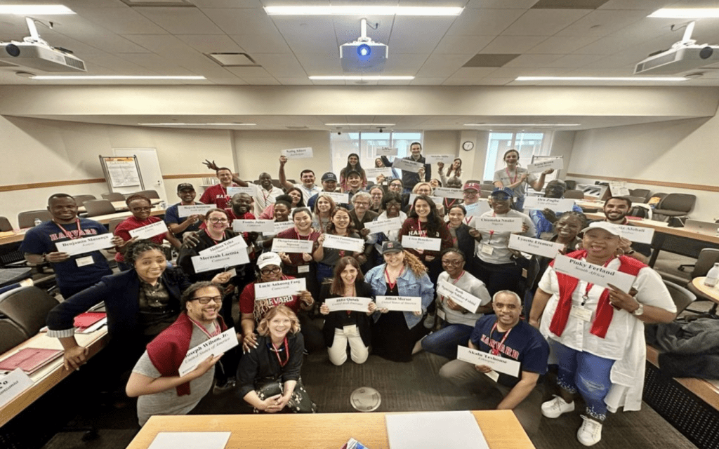 IPP classroom photo with participants holding name tags