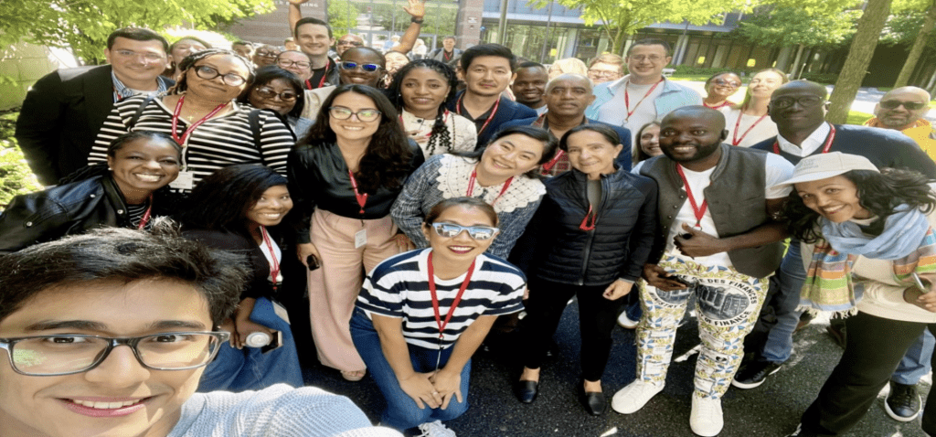Participants posing for a group photo on campus