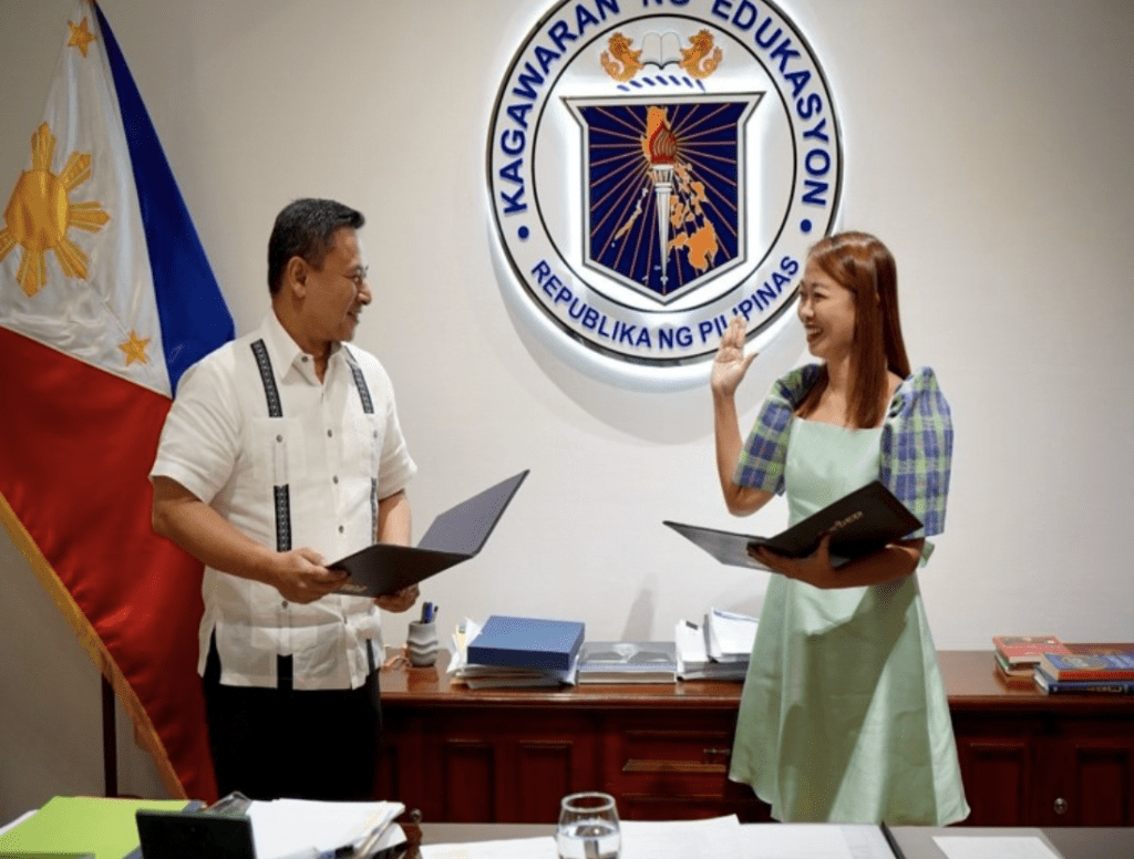 2 people getting appointed in a Filipino government building