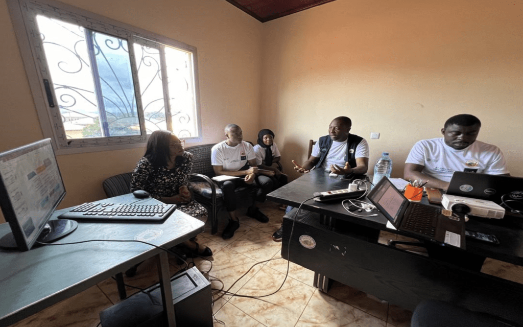 People collaborating in an office with computers