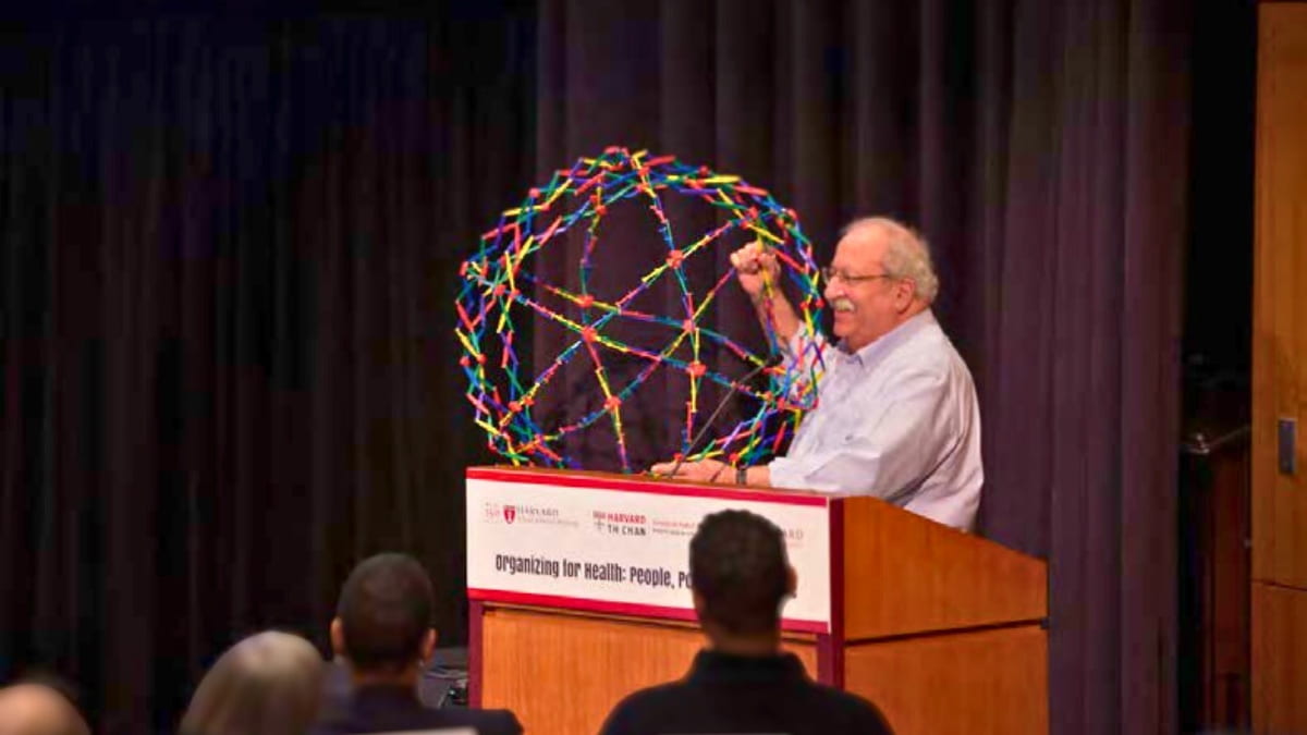Marshall Ganz holding a Hoberman sphere