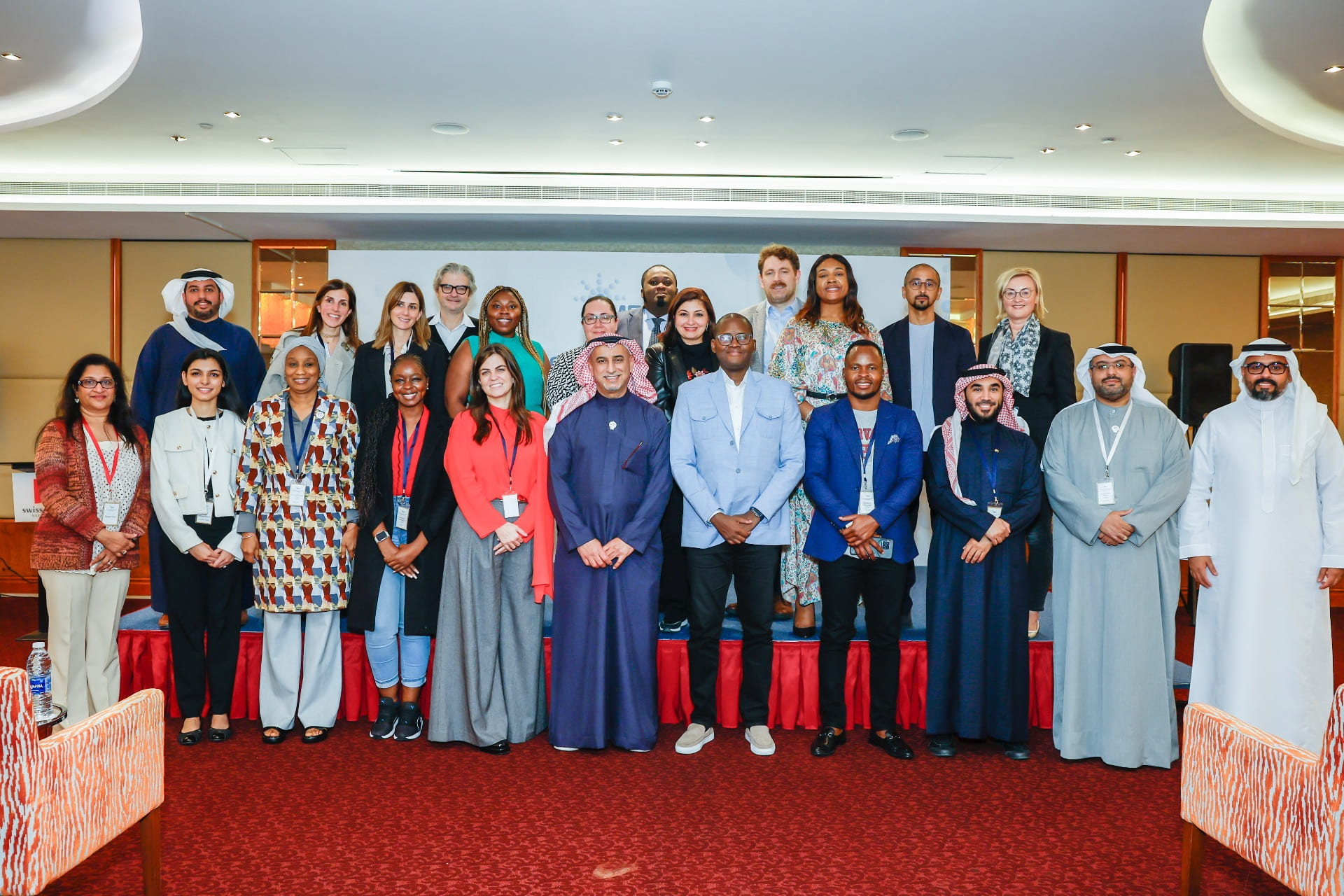 Alumni and BSC team members standing on stage at the IPP Alumni Seminar in Bahrain 