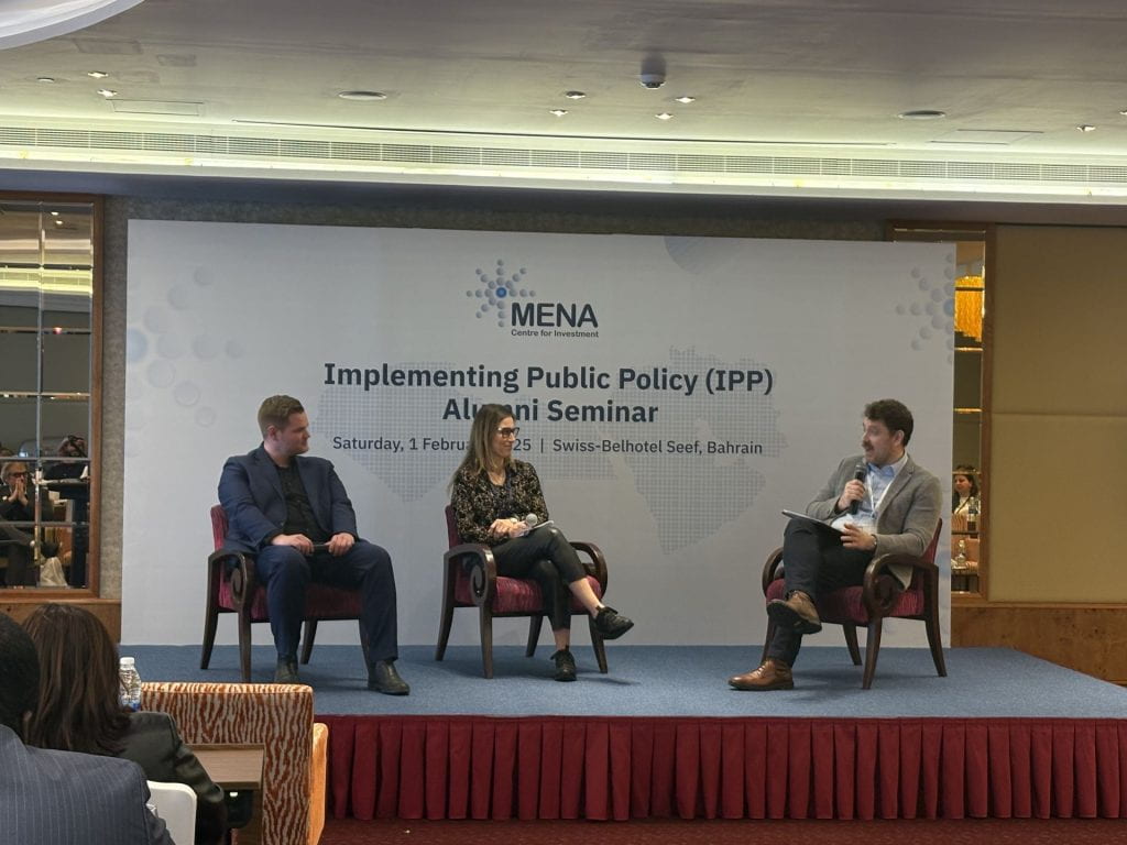 Tim Kornprobst, Lobna Jeribi, and Peter Harrington seated on stage in conversation