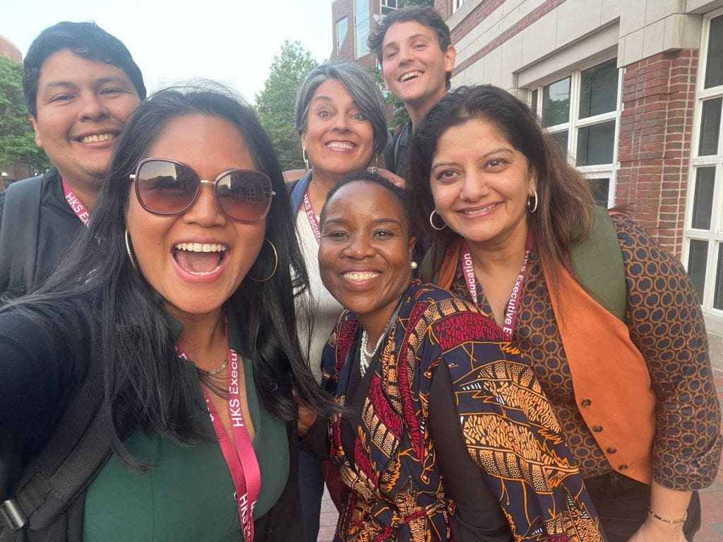 Participants smiling in Harvard Square