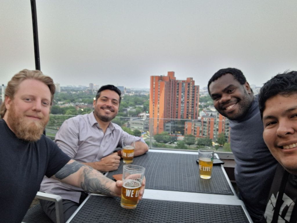 Participants at a rooftop bar in Boston