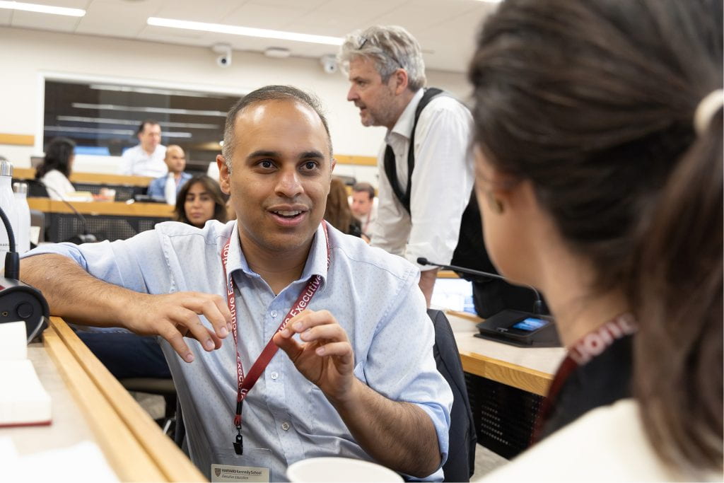 IPP participant engaging in discussion with classmate