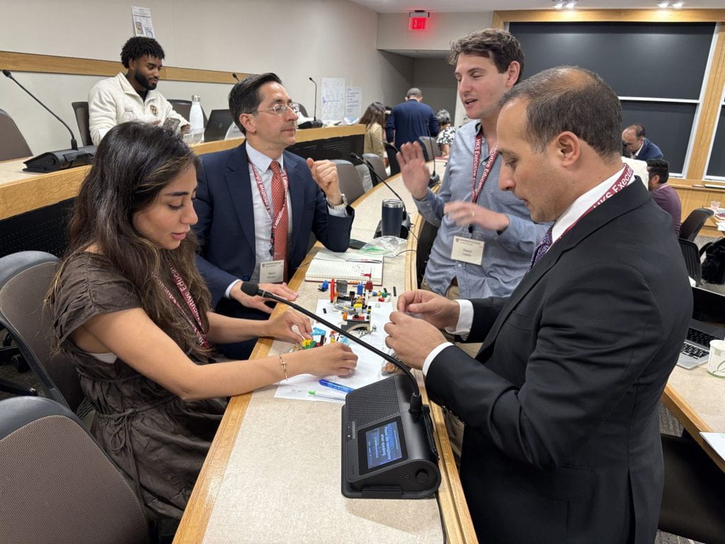 Participants collaborating on an exercise using legos