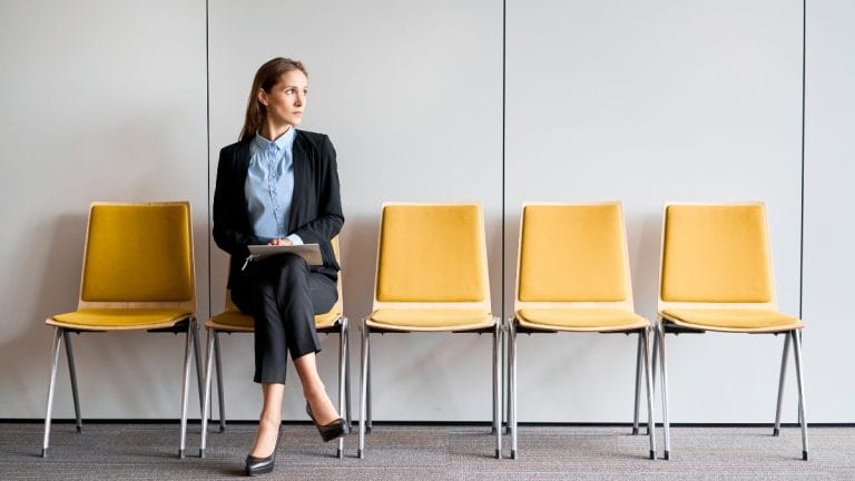 Woman seated in waiting room for interview