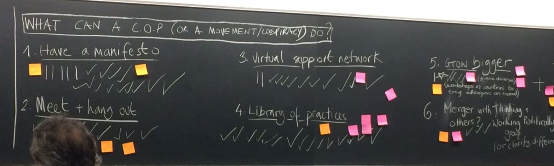 Blackboard with "What can a CoP (or movement) do?" written