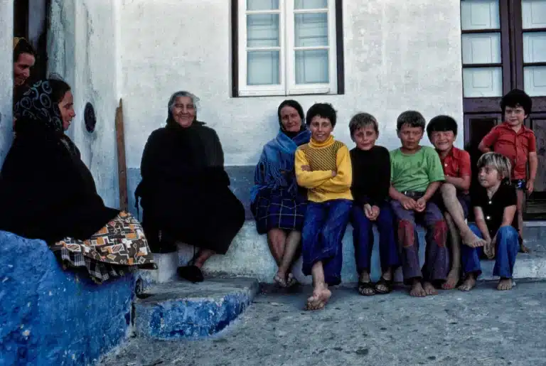 Portuguese children sitting on the curb