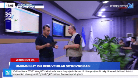 Screenshot of a news story publicizing the initiative, showing two men talking in a conference room.