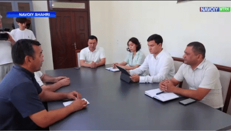 Screenshot of a news story publicizing the initiative, showing a smaller meeting with members.