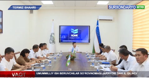 Screenshot of a news story publicizing the initiative, showing a full meeting in a conference room.